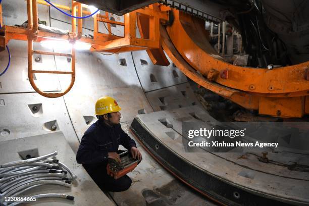 Jan. 29, 2021 -- Jia Deku works on a project of the subway Line No.5 in Hefei, capital of east China's Anhui Province, Jan. 28, 2021. Jia Deku and...