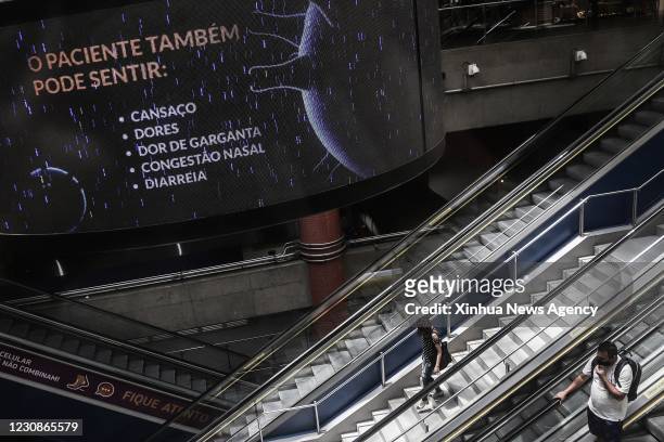 Jan. 29, 2021 -- A screen showing possible symptoms of COVID-19 is pictured at a subway station in Sao Paulo, Brazil, Jan. 28, 2021. Brazil on...
