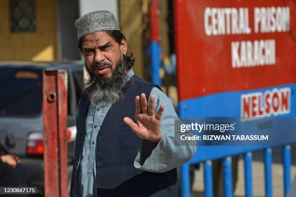 Sheikh Aslam, brother of Sheikh Adil, one of the accused of murdering US journalist Daniel Pearl, gestures as he walks out from the central prison...