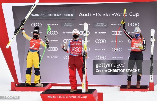 Second placed Norway's Kajsa Vickhoff Lie, winner Switzerland's Lara Gut-Behrami and third placed Canada's Marie-Michele Gagnon celebrate during the...