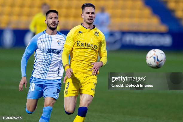 Cayetano Quintana of Malaga CF and Jose Carlos Ramirez of AD Alcorcon battle for the ball during the Liga Smartbank match betwen AD Alcorcon and...