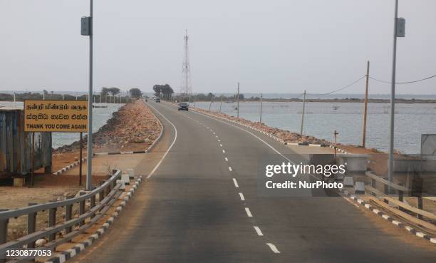 Road leading to the Sangupiddy Bridge in Jaffna, Sri Lanka. Sangupiddy Bridge is a road bridge across Jaffna Lagoon in northern Sri Lanka. It...