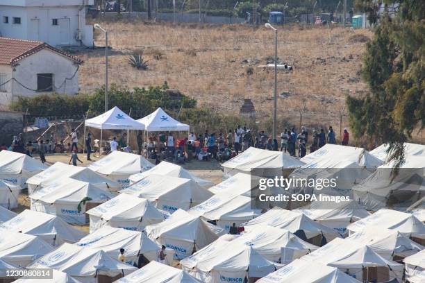 Panoramic view of the new temporary Refugee Camp with tents. The Karatepe, Kara Tepe or Mavrovouni refugee camp was built after the fire in Moria...