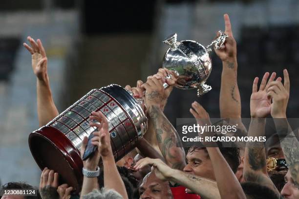 Players of Palmeiras celebrate with the trophy after winning the Copa Libertadores football tournament by defeating Santos 1-0 in the all-Brazilian...