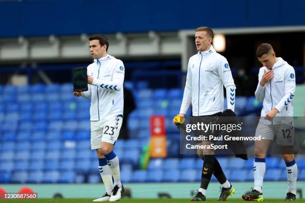 Everton's Seamus Coleman leads the team out onto the pitch carrying an iPad during the Premier League match between Everton and Newcastle United at...