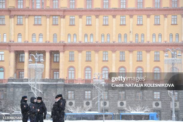 Police officers stand guard near the headquarters of the Federal Security Service, Russia's main security agency, prior to an expected rally in...