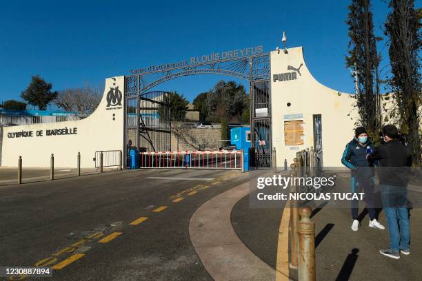 Fan answers to a journalist in front of Olympique de Marseille' Robert-Louis-Dreyfus training centre in Marseille, southeastern France, on January 31...
