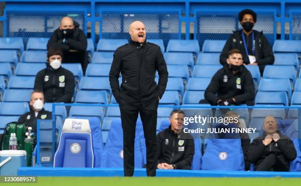 Burnley's English manager Sean Dyche shouts instructions to his players from the touchline during the English Premier League football match between...