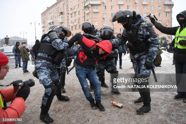 Riot police detain a man during a rally in support of jailed opposition leader Alexei Navalny in Moscow on January 31, 2021. - Navalny was detained...