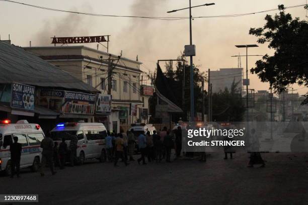 Ambulances wait near the site where a bomb blasted in Mogadishu, Somalia, on January 31, 2021. - Armed men attacked a hotel in central Mogadishu...
