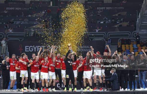 Danish handball team celebrates after winning the 27th IHF Men's World Championship final between Denmark and Sweden at Cairo Stadium Sports Hall on...