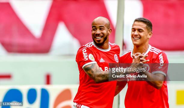 Patrick of Internacional celebrates with teammate after scoring the first goal of his team during the match between Internacional and Red Bull...