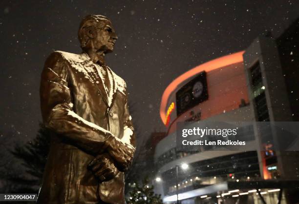 Snow falls on the statue of former Philadelphia Flyers owner and COO Ed Snider prior to the Flyers playing the New York Islanders at the Wells Fargo...