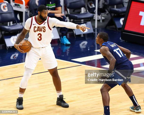 Andre Drummond of the Cleveland Cavaliers looks to pass the ball as Ed Davis of the Minnesota Timberwolves guards him during the third quarter at...