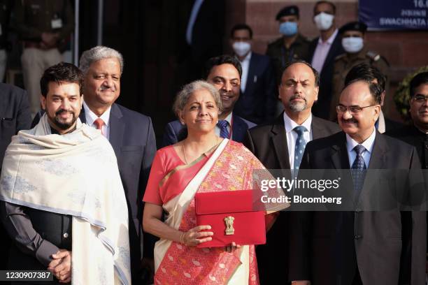 Nirmala Sitharaman, India's finance minister, center, Anurag Thakur, India's finance and corporate affairs minister, left, and other members of the...