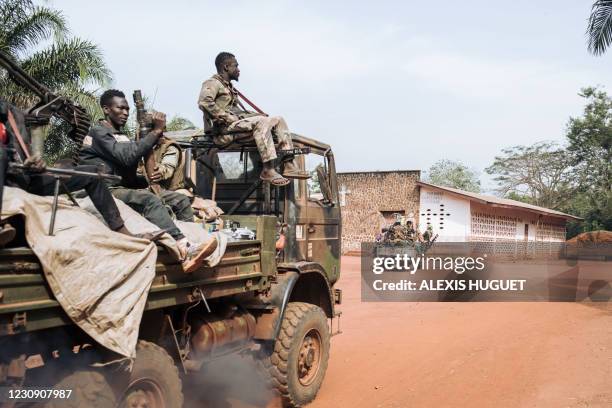 Militiamen of the armed group coalition Coalition of Patriots for Change patrol in the village of Niakari, which marks the front line with the...