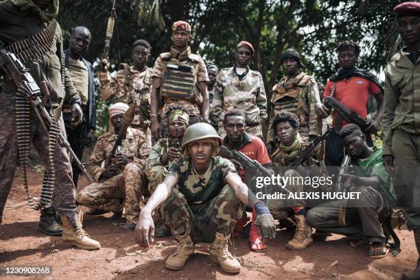 Militiamen, including alleged children, of the armed group coalition Coalition of Patriots for Change pose for a photograph in the village of...