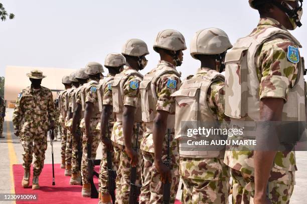 Chief of Defence Staff Major General Leo Irabor inspects soldiers standing on attention during a guard of honour for the newly appointed Nigerian...