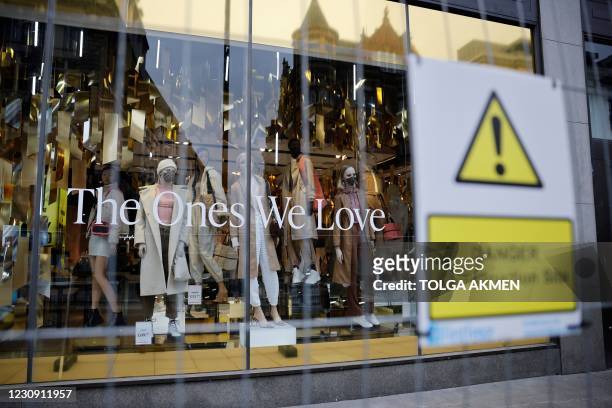 Closed branch of the fashion retailer Topshop is seen in central London on February 1, 2021. - UK online retailer ASOS has bought key brands from...