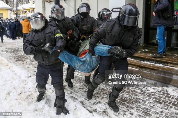 Protester seen under arrest by the police during the protest in support of the opposition political leader Alexei Navalny. Hundreds of protesters...