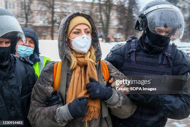 Female protester seen under arrest by the police during the protest in support of the opposition political leader Alexei Navalny. Hundreds of...