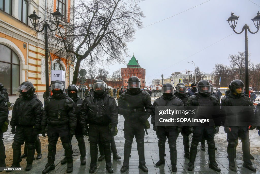 Riot police officers seen in the city center as protesters...