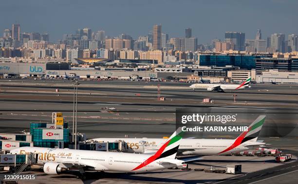 Picture shows Emirates Airlines aeroplanes at Dubai International Airport on February 1, 2021.