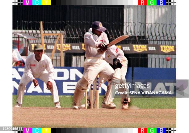 Sri Lanka's vice captain Aravinda de Silva slams the ball to score 168 on the final day of the first test against Pakistan 23 April in Colombo as...