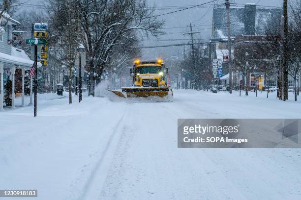 PennDOT plow truck clears the street of snow in Milford, as a Nor'easter pounds Pennsylvania and surrounding states. A Noreaster is currently hitting...