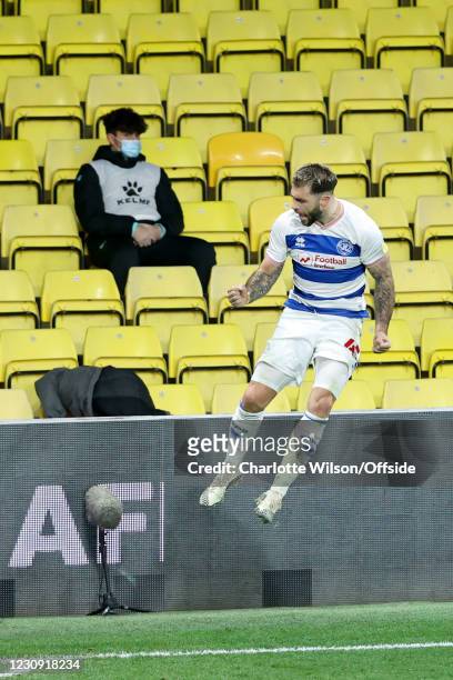 Ballboy looks unimpressed as Charlie Austin of QPR celebrates after scoring their 1st goal during the Sky Bet Championship match between Watford and...