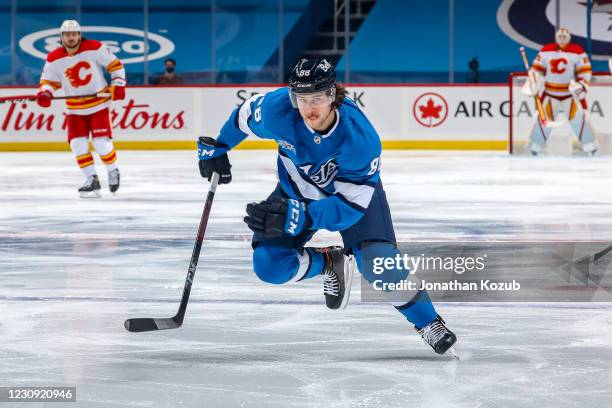 Nathan Beaulieu of the Winnipeg Jets follows the play down the ice during first period action against the Calgary Flames at the Bell MTS Place on...