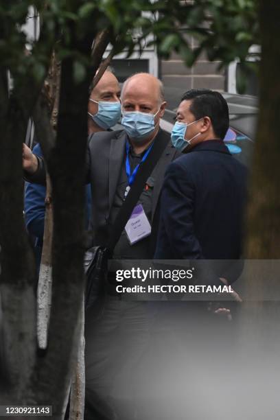 Members of the World Health Organization team investigating the origins of the Covid-19 coronavirus, arrive at the Hubei Center for animal disease...