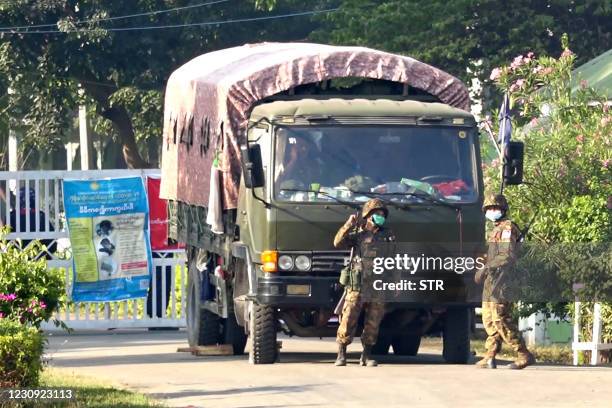 This screengrab taken from AFPTV video footage shows soldiers at the entrance to a guesthouse, where members of parliament reside at, in the...