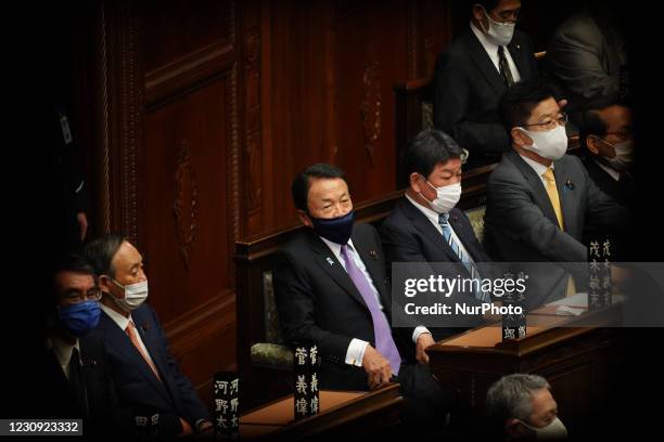 Key members of Japan's ruling Liberal Democratic Party, Yoshihide Suga , Taro Aso , Toshimitsu Motegi , take seats in the lower house on February 1,...