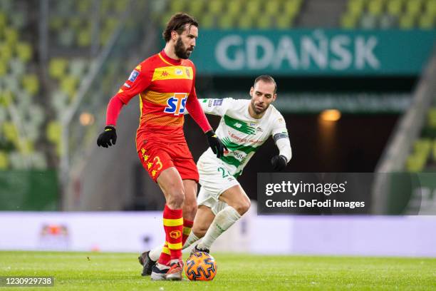 Blazej Augustyn of Jagiellonia Bialystok and Flavio Paixao of Lechia Gdansk battle for the ball during the Ekstraklasa between Lechia Gdansk and...