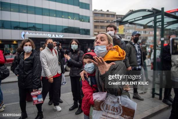 Woman reacts shoots at Turkish police on February 2, 2021 during a demonstration against Turkish President's appointment of a party loyalist to head...