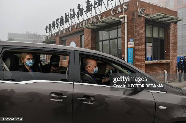 Peter Daszak , Thea Fischer and other members of the World Health Organization team investigating the origins of the COVID-19 coronavirus, arrive at...