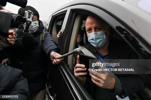 Peter Daszak, a member of the World Health Organization team investigating the origins of the COVID-19 coronavirus, speaks to media upon arriving...