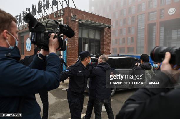 Members of the World Health Organization team investigating the origins of the COVID-19 coronavirus, arrive at the Wuhan Institute of Virology in...