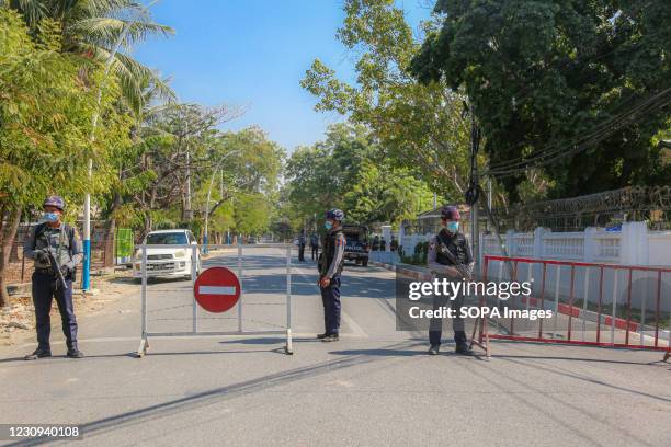 Police stand guard in front of the Mandalay Chief Minister, Dr. Zaw Myint Maung's House. Following the arrest and release of Dr. Zaw Myint Maung, the...