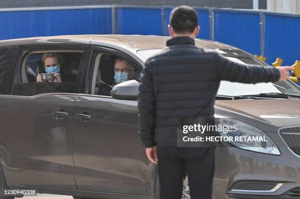 Thea Fischer and other members of the World Health Organization team investigating the origins of the COVID-19 coronavirus, leave the Wuhan Institute...