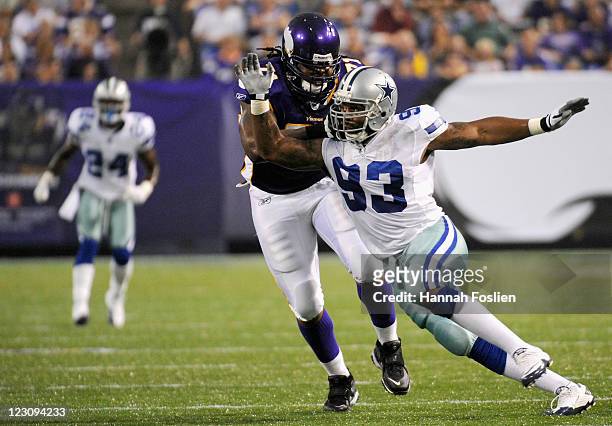 Phil Loadholt of the Minnesota Vikings makes contact with Anthony Spencer of the Dallas Cowboys on August 27, 2011 at Hubert H. Humphrey Metrodome in...
