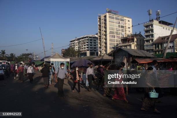 People walk to their work as usual after military coup on February 3, 2021 in Yangon, Myanmar.