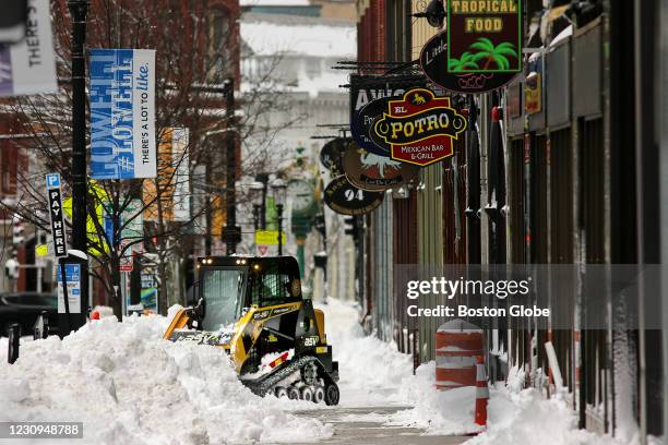 Caterpillar treads proved useful clearing downtown Lowell, MA sidewalks on Feb. 2, 2021. With well over a foot of snow on the ground after Monday...