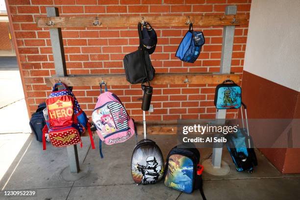 Backpacks return outside the first grade classroom of teacher Courtney Meyer at Alta Vista Elementary School on the second day of classes as Redondo...