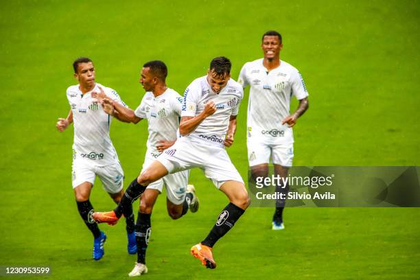 Kaio Jorge of Santos celebrates with teammates after scoring the first goal of his team during the match between Gremio and Santos as part of...