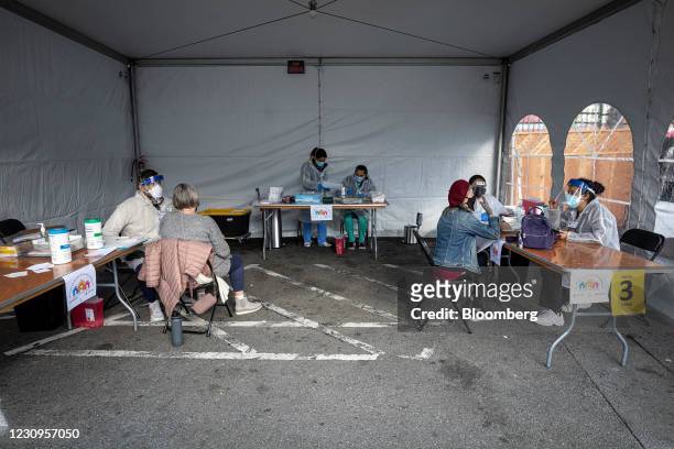 Healthcare workers administer doses of the Moderna Covid-19 vaccine at a walk up vaccination site in San Francisco, California, U.S., on Wednesday,...