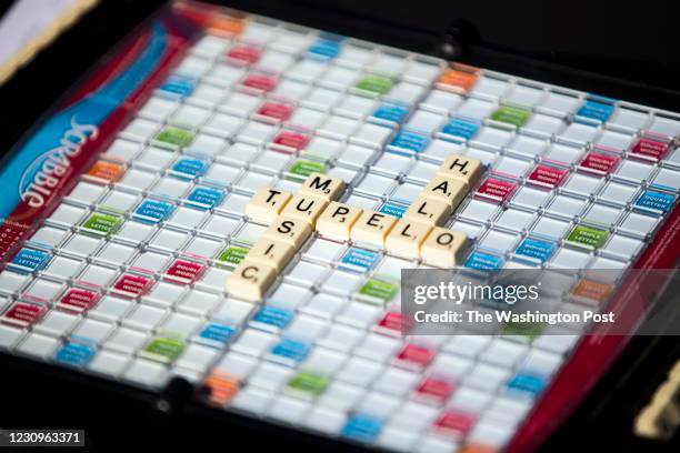 People play scrabble as they watch Tim Theriault perform at the first drive-in concert since the coronavirus outbreak at Tupelo Music Hall in Derry,...