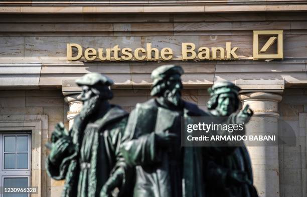 The logo of German giant Deutsche Bank is seen on one of their branches in Frankfurt am Main, western Germany, on February 4 as the bank publishes...