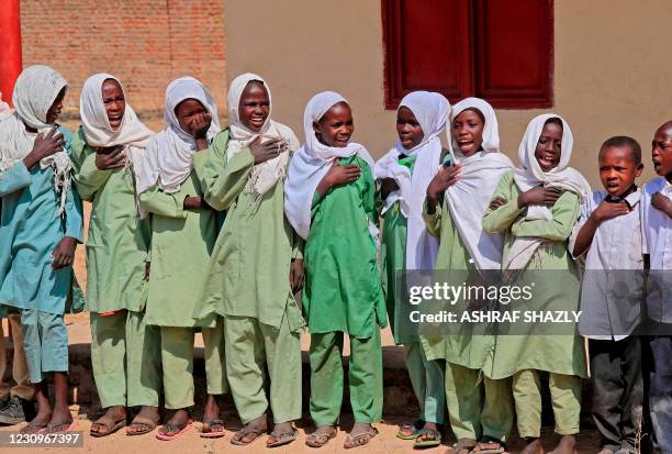 Picture taken in the South Darfur village of Hamada, north of the region's capital town Nyala on February 3 shows children at a school as residents...